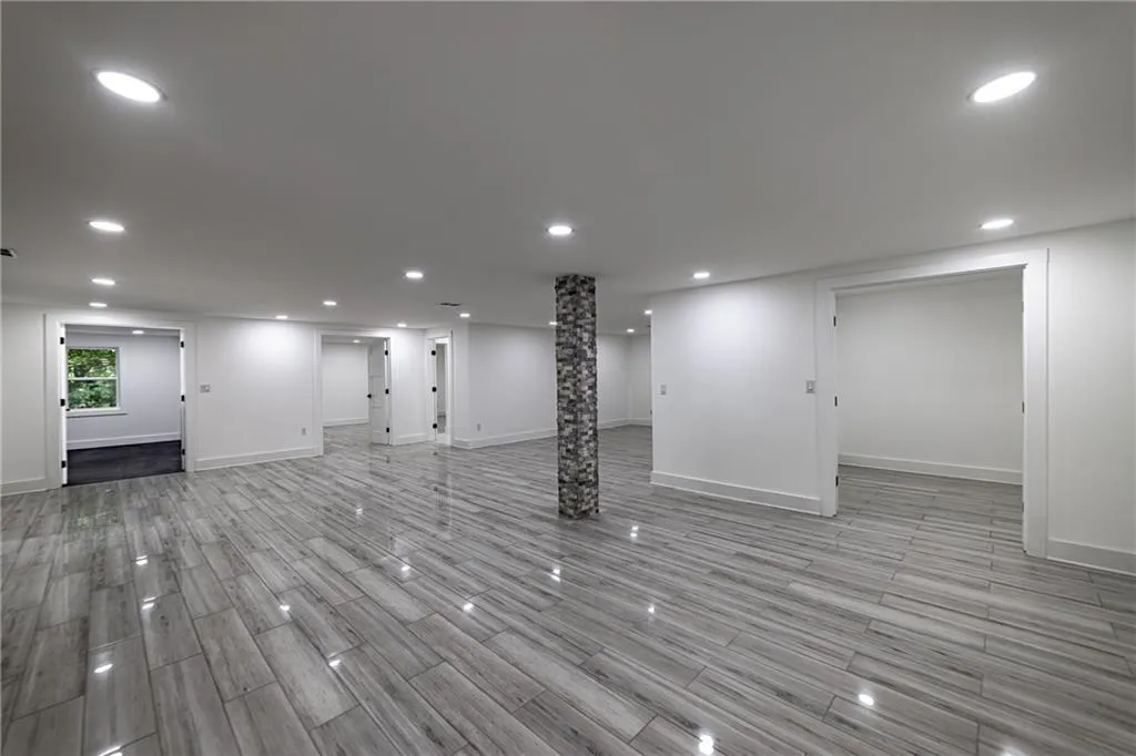 Basement featuring recessed lighting and light wood-type flooring