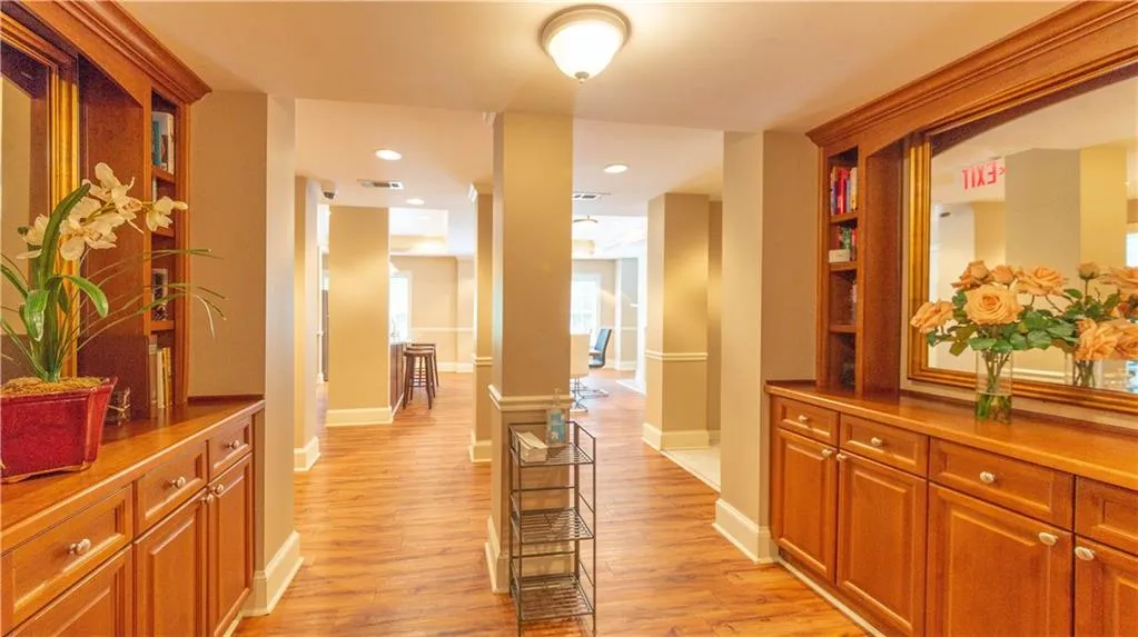 Corridor featuring light wood-style floors