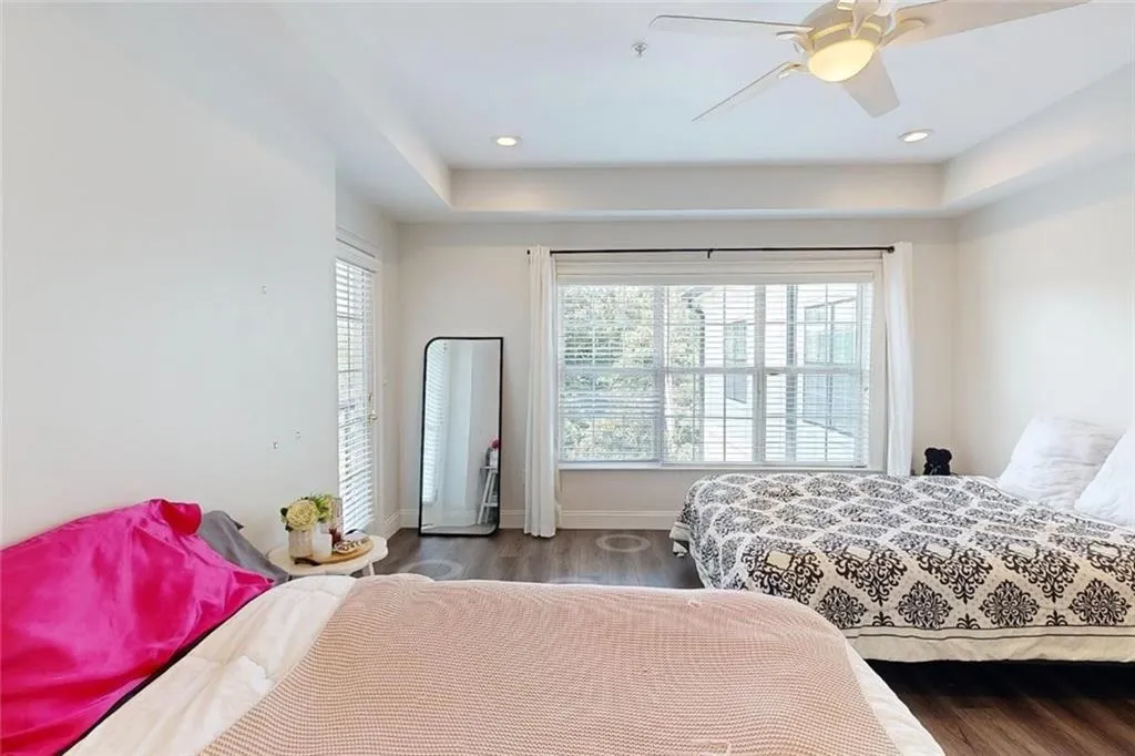 Bedroom featuring wood finished floors and a ceiling fan