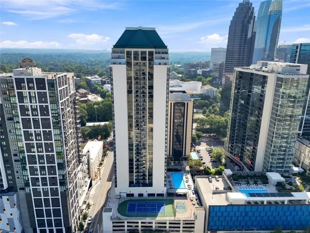 High-rise residential building with a distinctive peaked roof