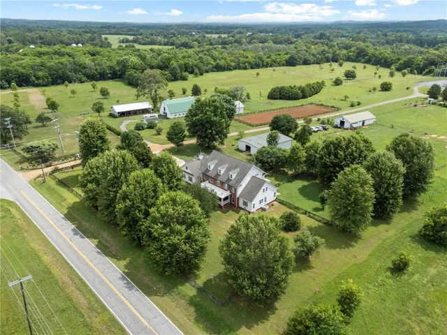 Aerial View of the home and expansive farm infrastructure.