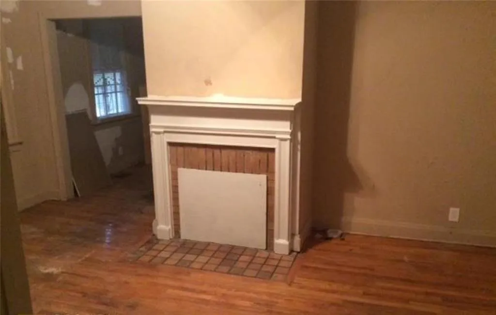 Interior details with baseboards and wood finished floors
