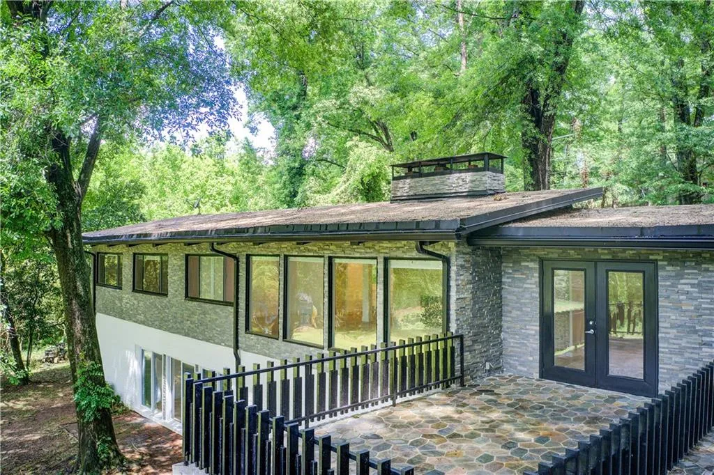 Rear view of property with french doors