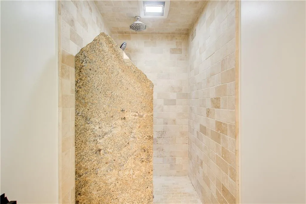 Bathroom view of a tile shower