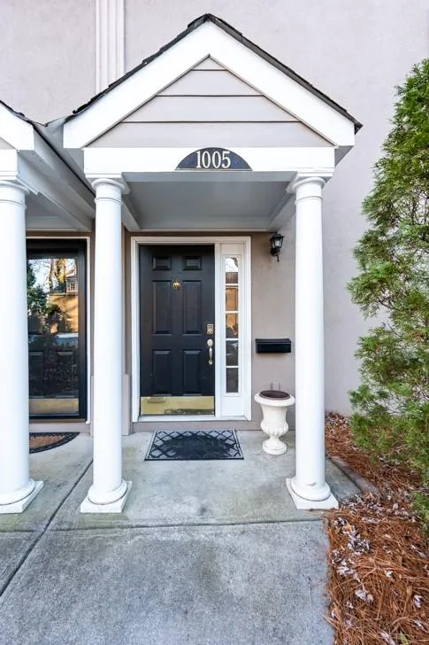 Entrance to property with stucco siding