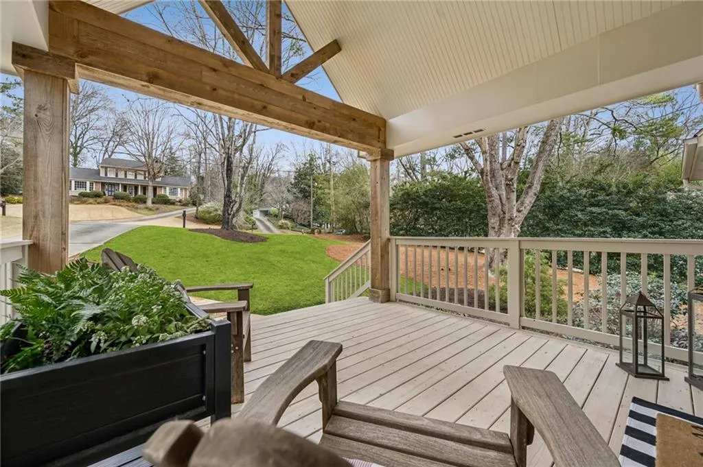 Wooden terrace with a lawn