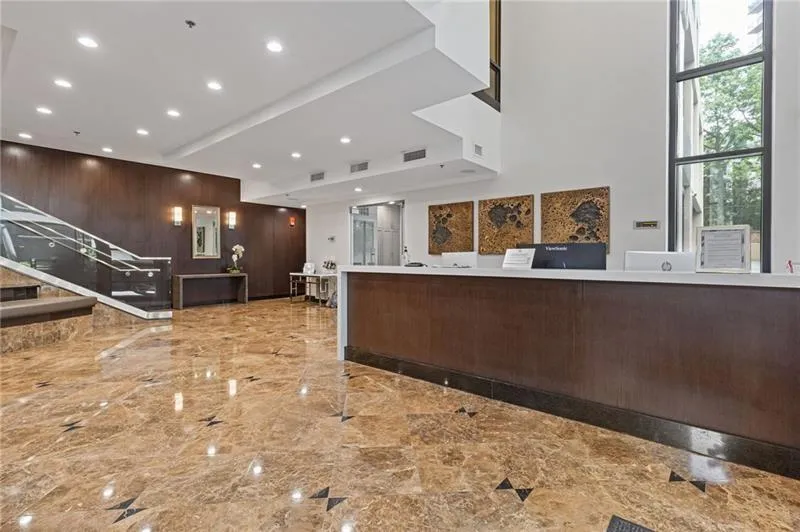 Reception area with wooden walls and stairway