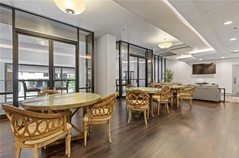 Dining room featuring dark wood-style floors