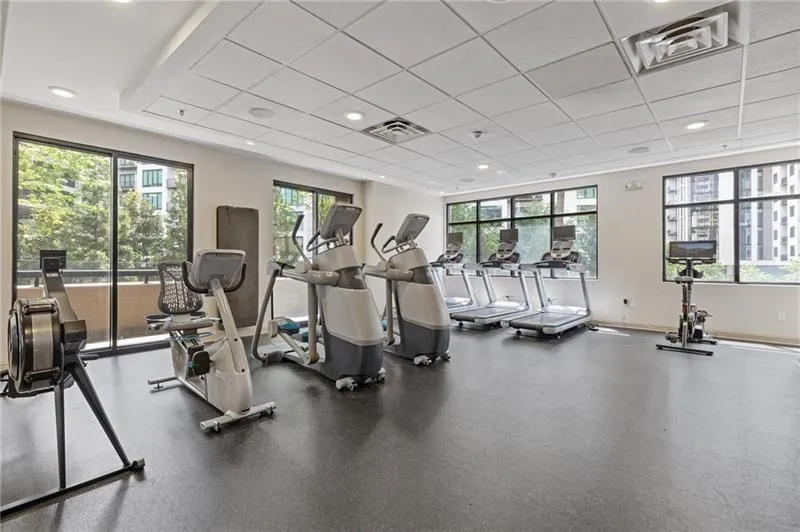 Gym featuring a drop ceiling and recessed lighting