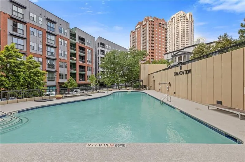 Community pool with a patio
