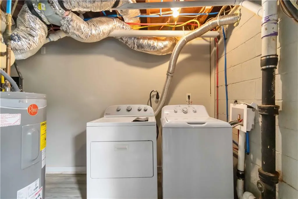 Washroom with electric water heater and independent washer and dryer