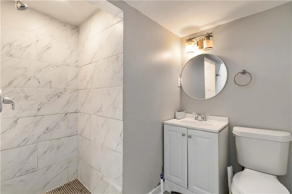 Bathroom with vanity and a shower stall