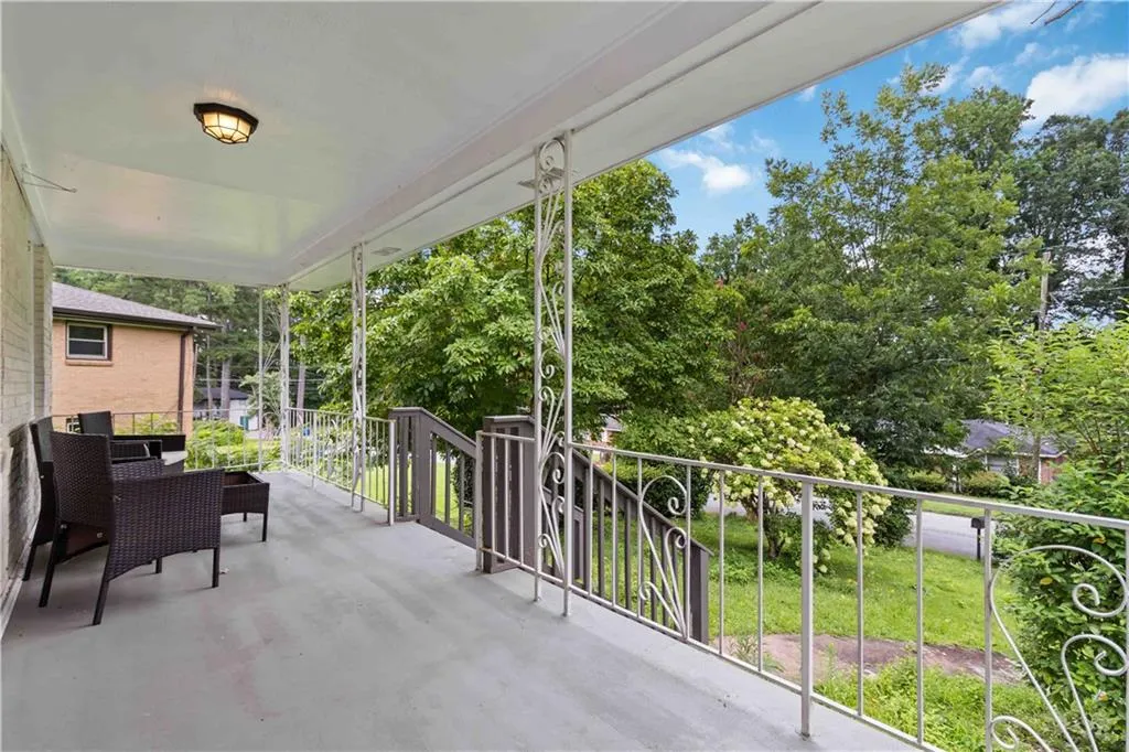 Patio / terrace with view of scattered trees