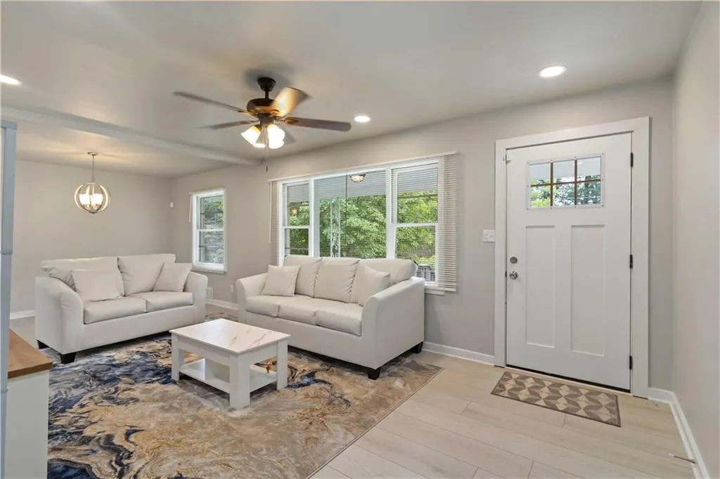 Living room featuring recessed lighting, wood finished floors, and a ceiling fan