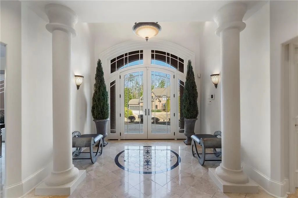 Dramatic entry opens up to the living room.