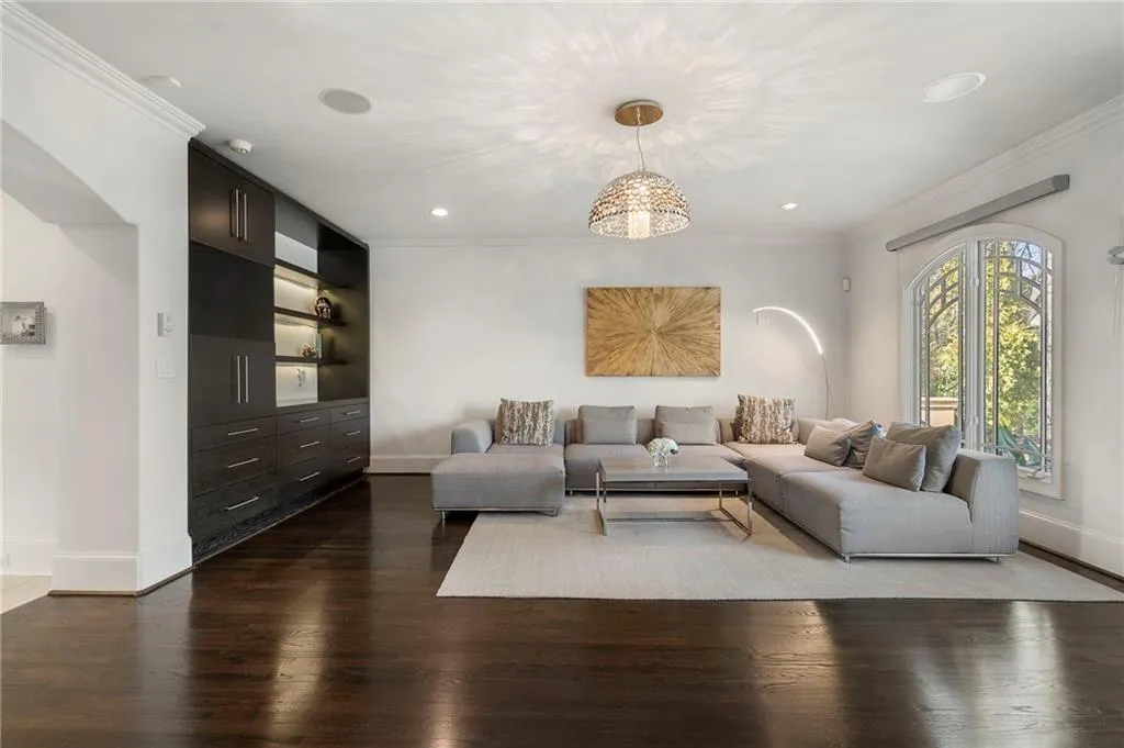 Motorized blinds in family room.