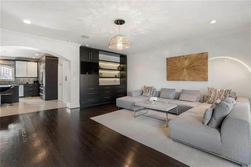 Open to the kitchen with hardwood flooring.