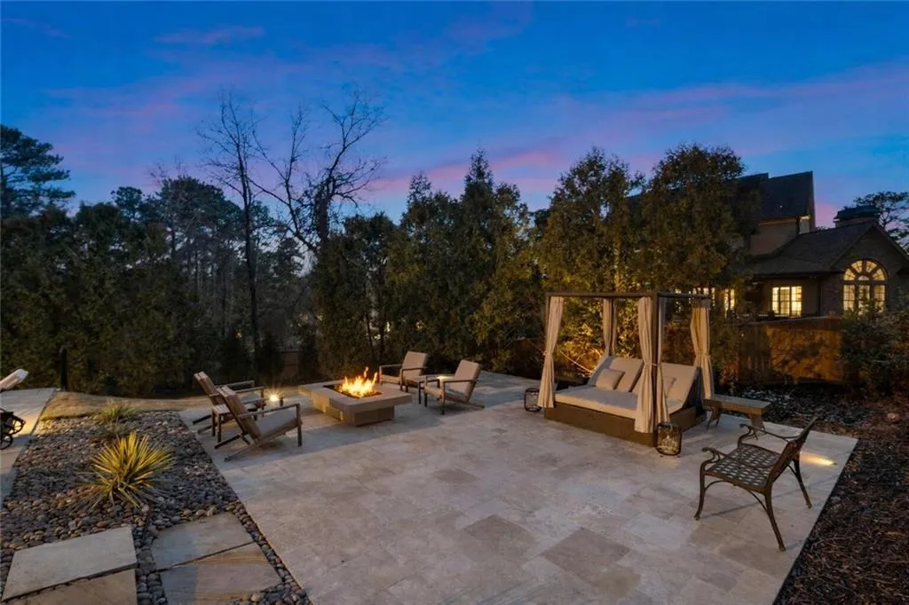 Multiple pool decks professionally landscaped all around the pool and pool house.