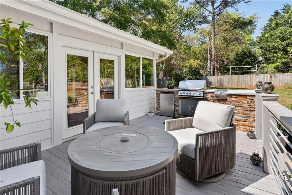 Deck with exterior kitchen and french doors