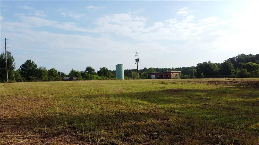 View of yard with a rural view