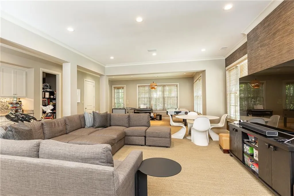 Generous daylight terrace level with full bedroom and ensuite bath, workout room, craft room, a half bath and plenty of room for friends