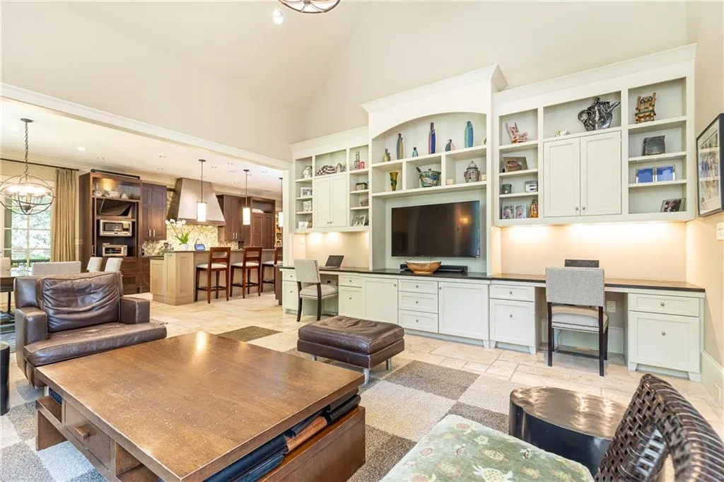 Generous keeping room with built in bookshelves and two desks