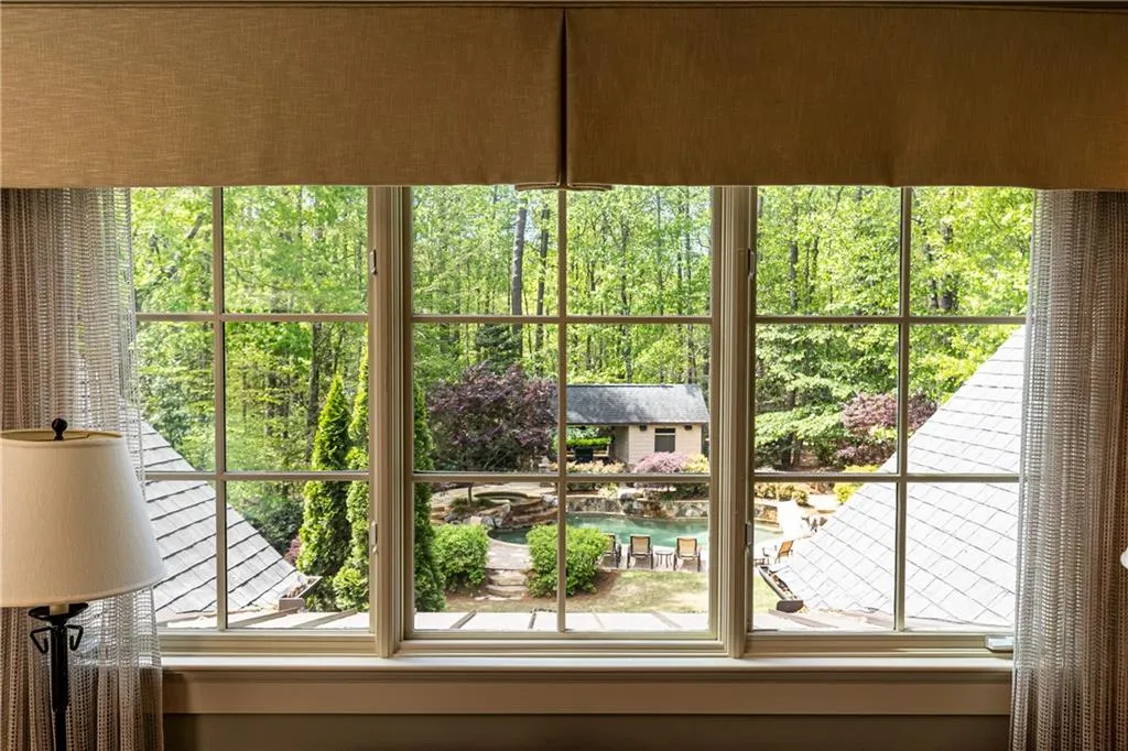 Lush wooded view from the primary suite sitting room