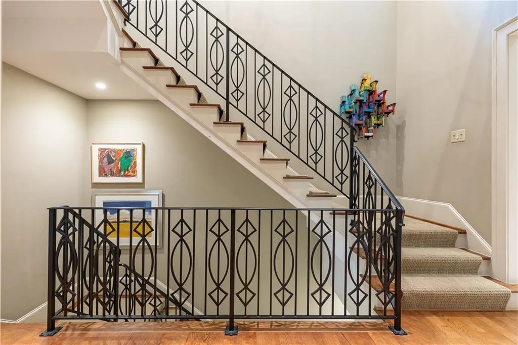 Custom wrought-iron banister and sophisticated continuous staircase