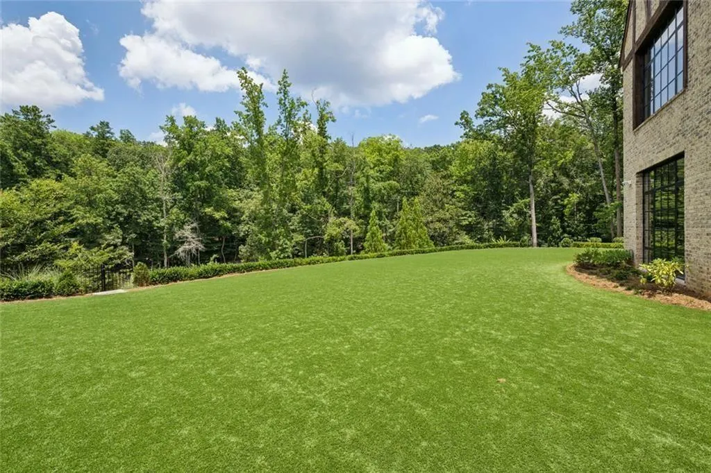 Turfed lower yard off terrace level.