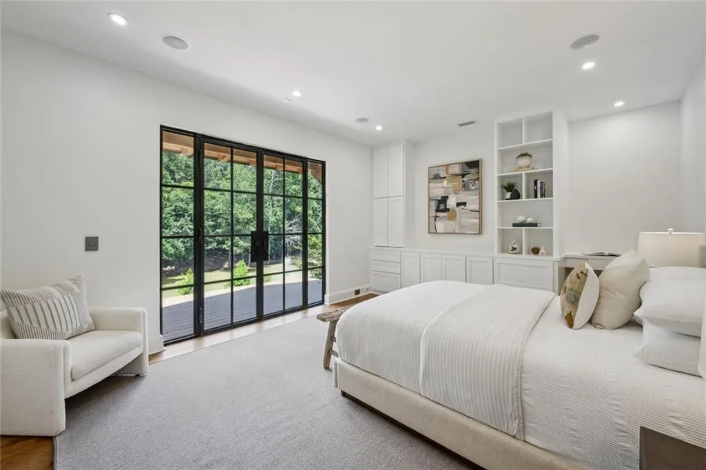 Lower level bedroom in guest house / pool house with private full bath.