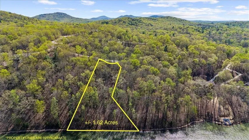 The only lakefront remaining in Lake Laceola- 198 ft of shoreline framed by the Blue Ridge