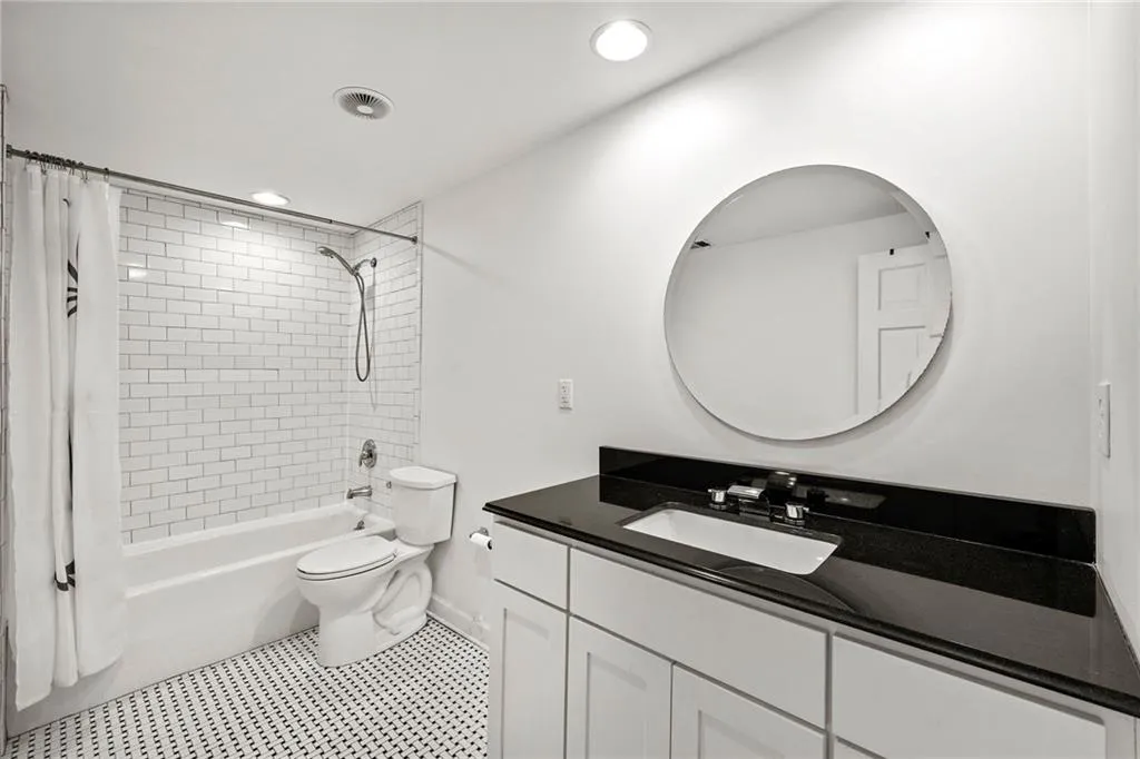 Full bathroom with shower / bathtub combination with curtain, vanity, recessed lighting, and tile patterned flooring