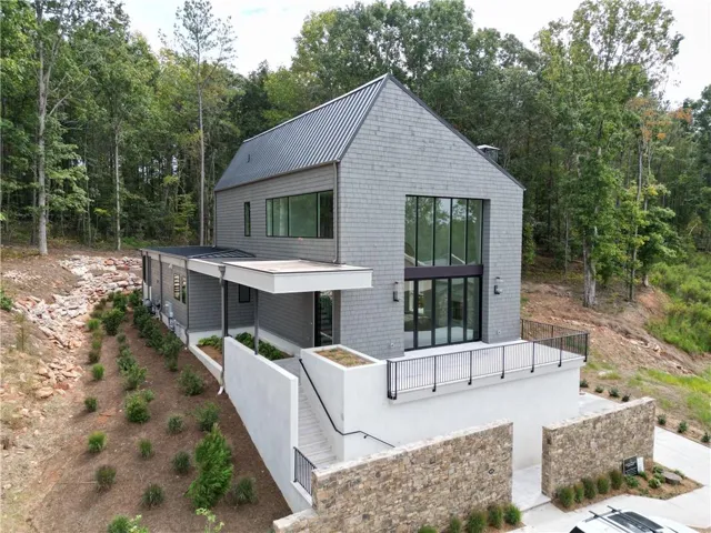 View of front facade featuring a standing seam roof