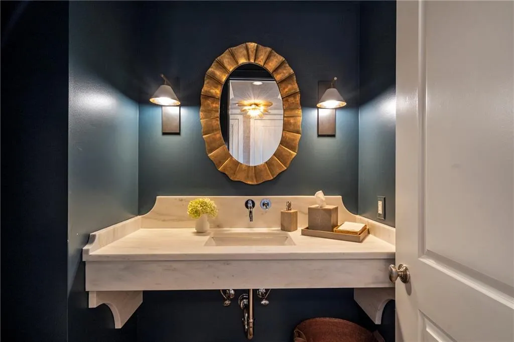 Floating vanity with an integrated sink and light-colored countertop