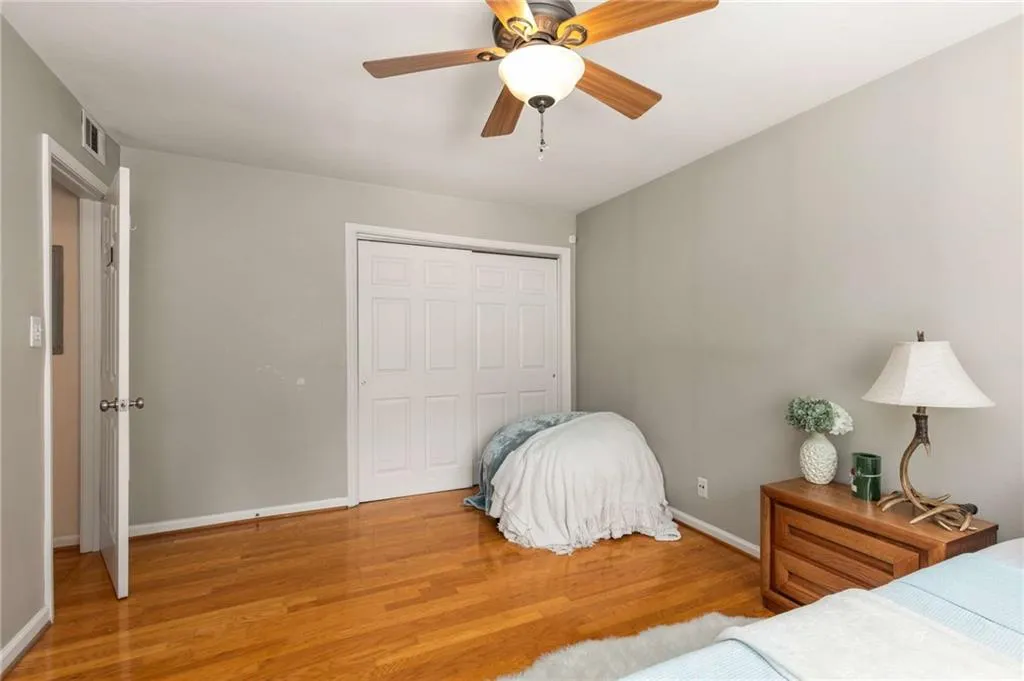 Bedroom with wood finished floors, Double closet in additional bedroom