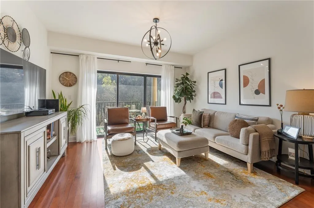 Generous living area enhanced by gleaming hardwood floors and stunning views of the community.