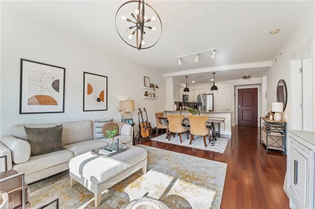 Generous living area enhanced by gleaming hardwood floors and stunning views of the community.