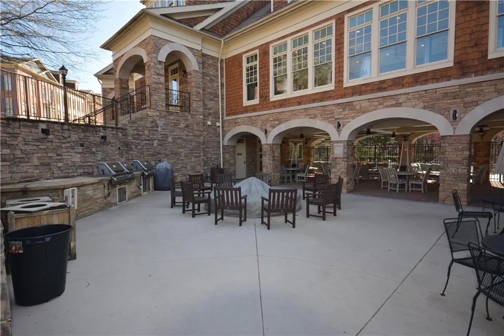 Large community clubhouse that has a gym, massage chairs, spa, coffee bar area, grilling area, and two salt water pools.