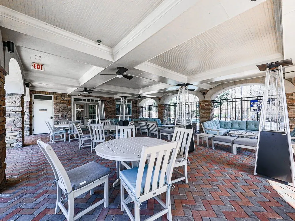 Large community clubhouse that has a gym, massage chairs, spa, coffee bar area, grilling area, and two salt water pools.