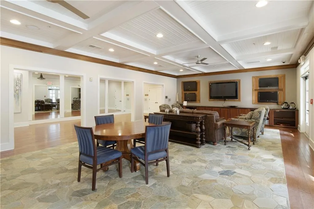 Large community clubhouse that has a gym, massage chairs, spa, coffee bar area, grilling area, and two salt water pools.