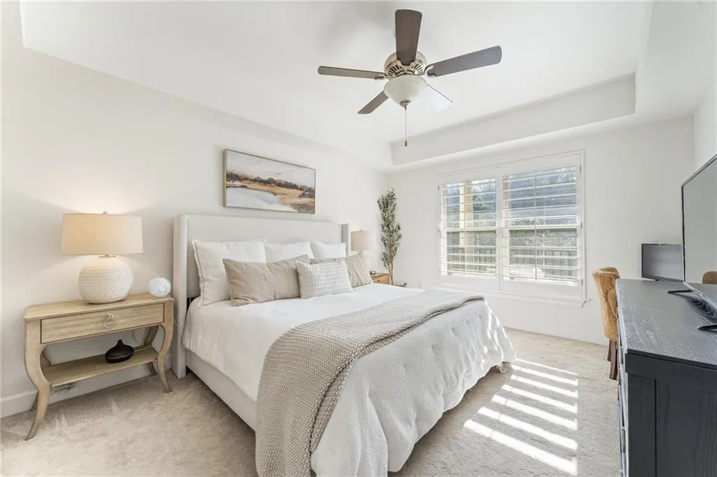 The oversized bedroom fits king-size bed, with a walk-in closet for ample storage.