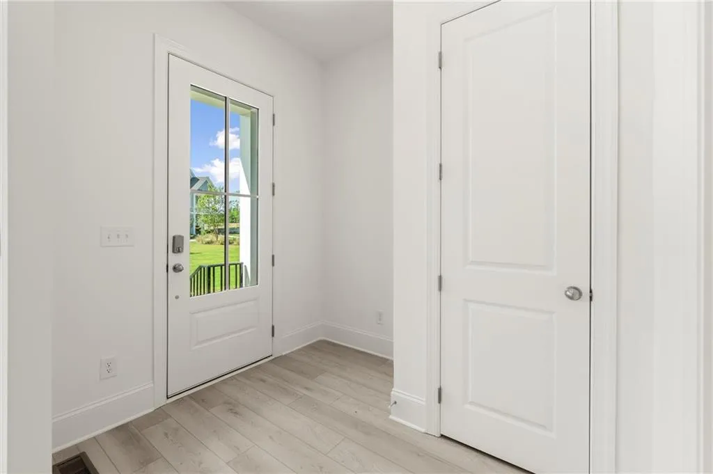 Entryway featuring light wood-style floors and baseboards