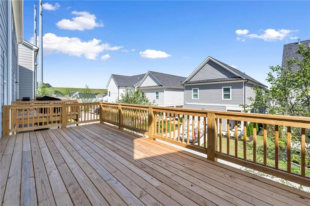 Wooden deck featuring a residential view