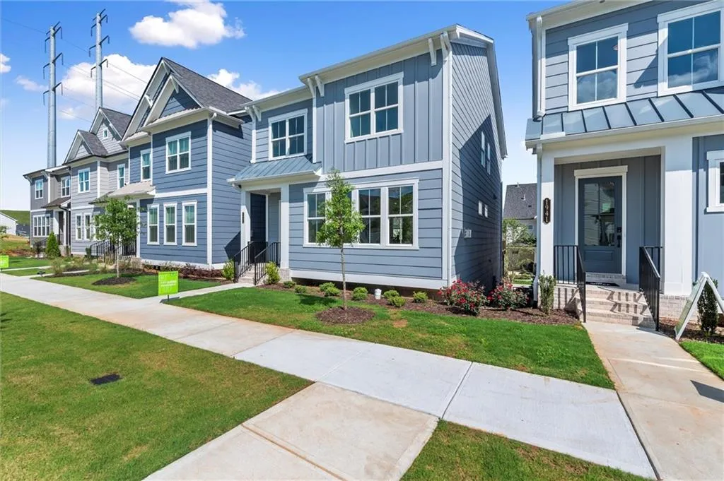 Single-family property featuring board and batten siding, a front yard, a standing seam roof, a residential view, and metal roof