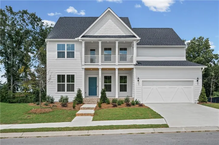 Contemporary two-story residence featuring white siding and a dark shingle roof