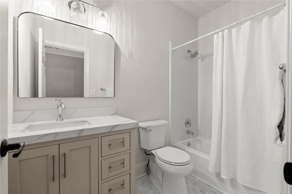 Full bathroom with vanity and shower / tub combo