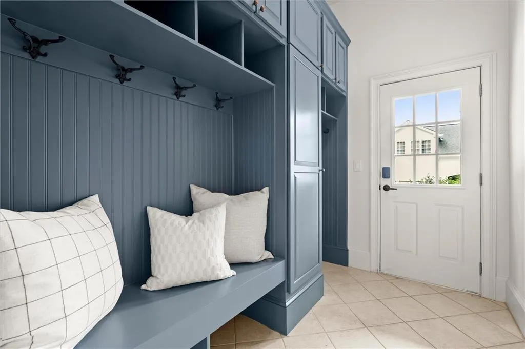 Mudroom with light tile patterned floors