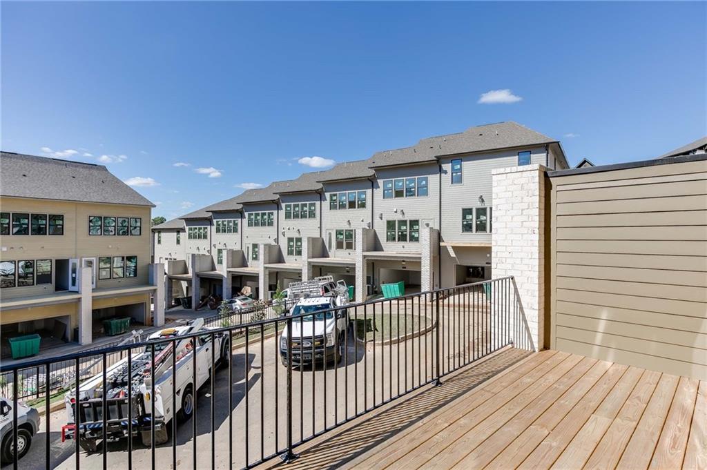 Another deck view which shows the additional guest parking in rear of home.