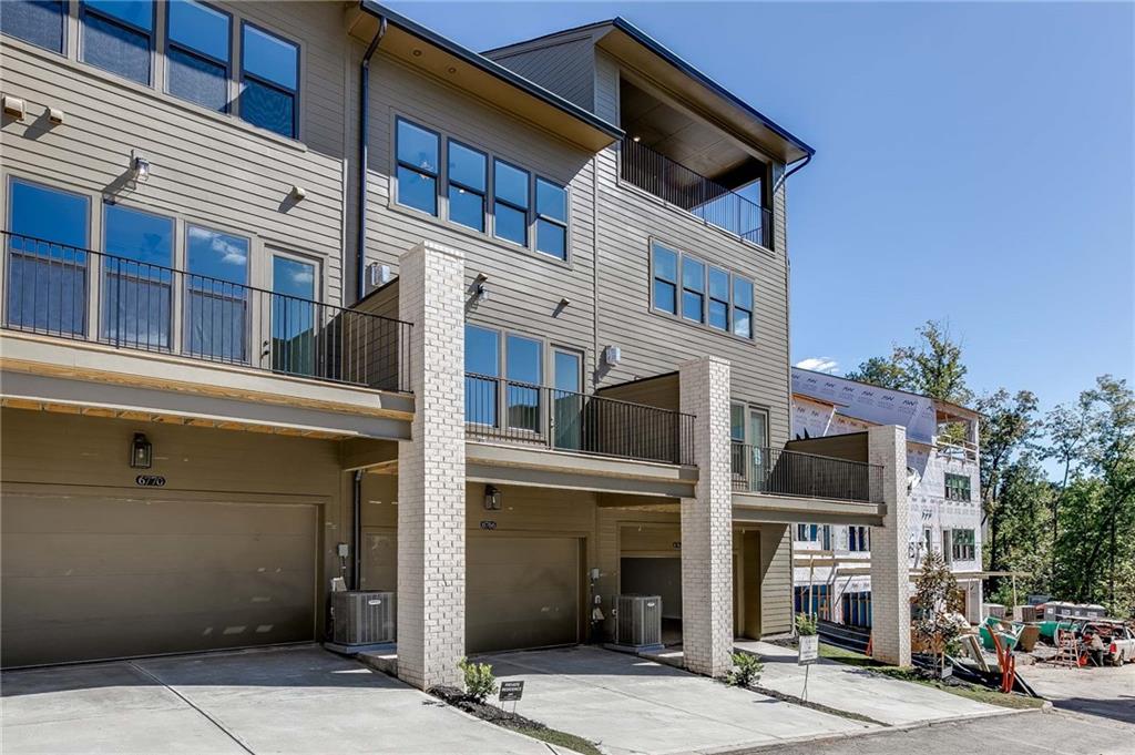 Rear view of this Prelude plan with 2 car garage and two car driveway!