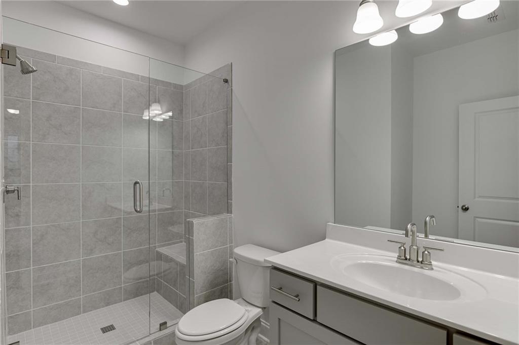 The ensuite terrace bath has wonderful walk in shower with frameless door.